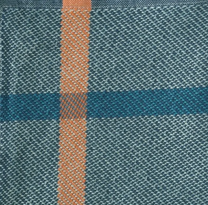 Close-up of woven fabric with blue and brown pattern