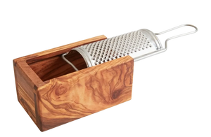 Wooden cheese grater with metal surface on a white background