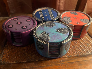 Set of colorful round coasters on a wooden surface