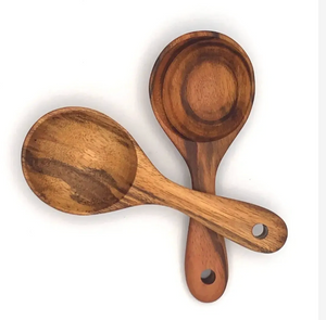 Two wooden spoons on a white background