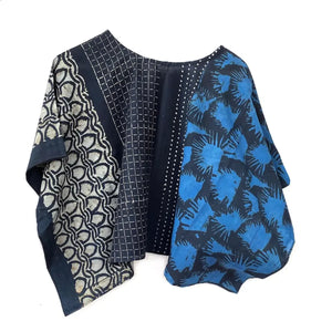 Fabric crop top with geometric and abstract patterns on a white background