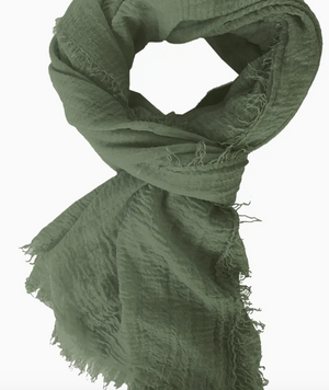 Green scarf with frayed edges on a white background