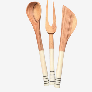 Set of wooden utensils with white handles on a white background
