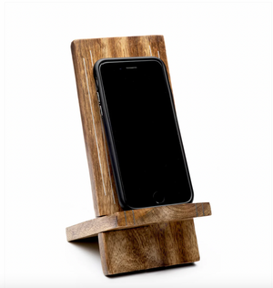 Wooden phone stand holding a smartphone on a white background