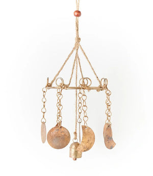 Decorative hanging mobile with gold and bronze elements on a white background