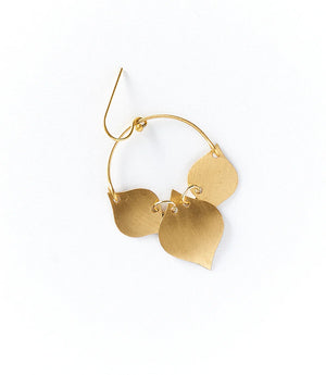 Gold hoop earrings with leaf-shaped pendants on a white background