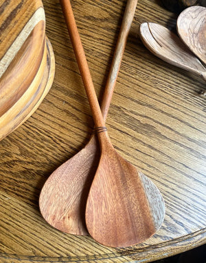 Wooden spoons on a wooden surface