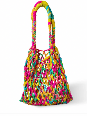 Colorful woven handbag on a white background