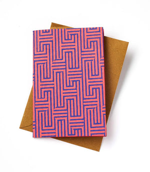 Notecard with pink geometric pattern on a brown envelope