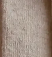 Close-up of a textured brown fabric surface