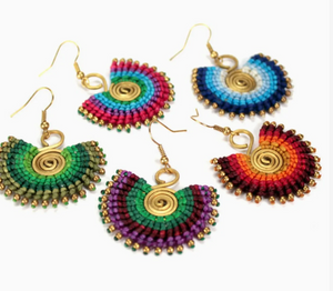 Set of colorful beaded earrings on a white background