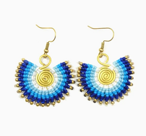 Pair of beaded earrings with blue and gold design on a white background