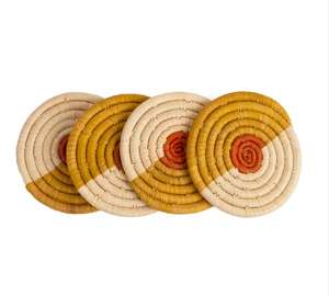 Set of four multicolor round woven coasters with concentric circle pattern on a white background