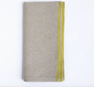 Folded beige napkin with a yellow stripe on a white background