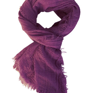 Purple scarf with frayed edges on a white background