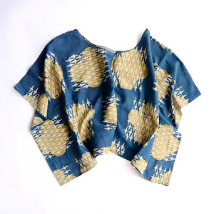Blue shirt with geometric pattern on a white background