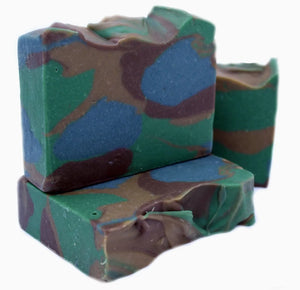Three bars of multicolored soap with green, brown, and blue on a white background.