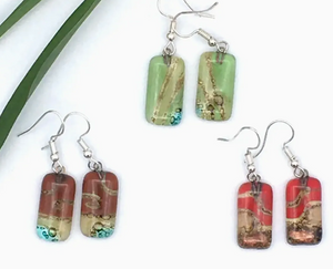 Set of earrings with rectangular, multicolored stone pendants on a white background.