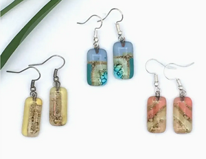 Set of earrings with rectangular, multicolored stone pendants on a white background.