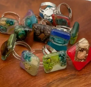 Collection of colorful rings on a wooden surface