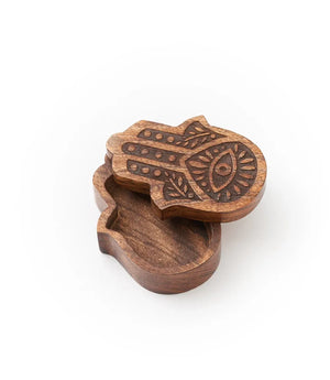 Wooden Hamsa hand-shaped box on a white background