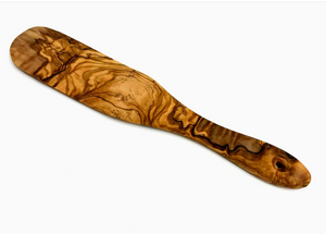 Wooden spatula with a wavy grain pattern on a white background