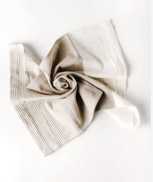 Folded beige fabric on a white background