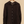 Brown shirt on a hanger against a beige background