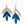 Colorful leaf-shaped earrings on a white background