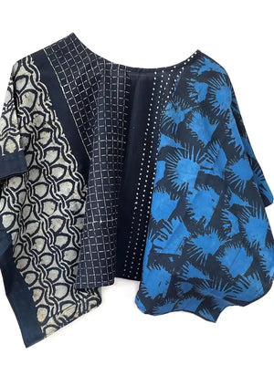 Fabric crop top with geometric and abstract patterns on a white background