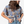 Person wearing a blue patterned shirt with a plain white background.