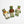 Three knitted frog toys dressed in different outfits on a white background