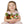 Young girl holding three knitted frog toys against a white background