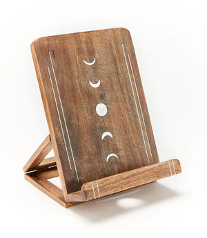 Wooden stand with moon phase design on a white background