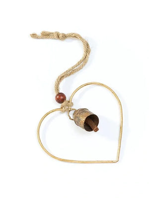 Heart-shaped gold pendant with a wooden bead on a white background