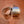 Silver and gold earrings on a wooden surface