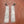Silver patterned earrings on a wooden surface