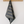 Striped grey towel hanging on a wooden rack against a white wall