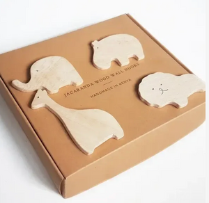 Set of four animal-shaped wooden wall hooks in a cardboard box, with 'Jacaranda Wood Wall Hooks' branding.
