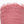 Pink textured fabric with frayed edges on a white background