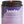 Close up of lit Kandu lavender cypress candle on white background