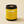 Kandu candle with a yellow label on a beige background