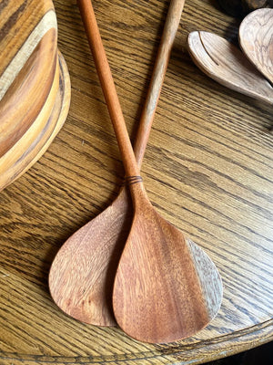 Wooden spoons on a wooden surface