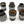 Set of six black ceramic vases with geometric patterns on a white background