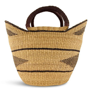 Woven tote basket with brown handles on a white background