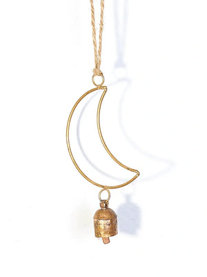 Gold crescent moon necklace with a small bell pendant on a white background