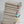 Stack of folded napkins with colorful stripes on a white plate against a light gray background