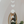 Decorative hanging with moon phase design in front of a mirror
