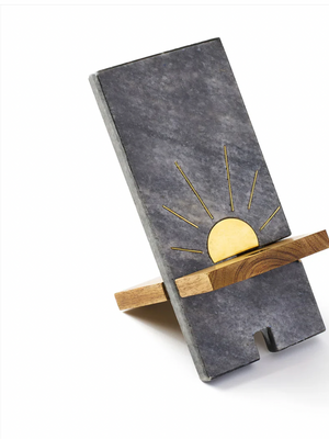 Phone stand with sun design on a white background