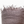 Textured brown fabric with frayed edges on a white background